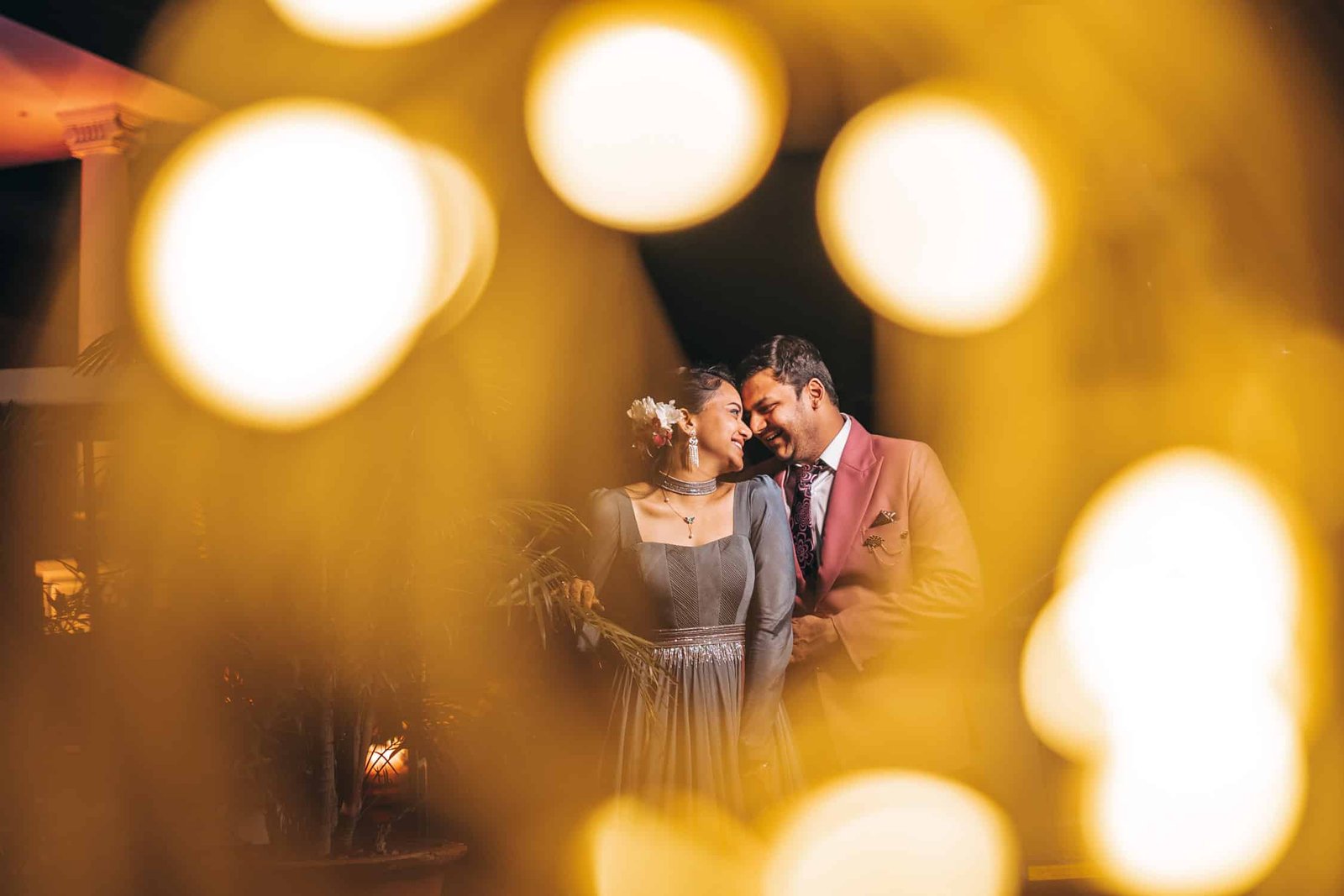 pre wedding shoot of indian couple through lights